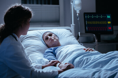 senior woman lying in hospital bed